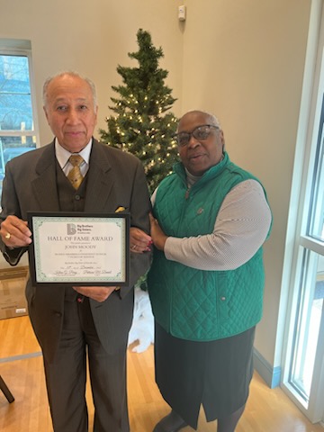 BBBS CEO Pat Daniel is pictured with John Moody. John Moody is holding his award for 7 years of service as a Board Member and Consistent Donor.